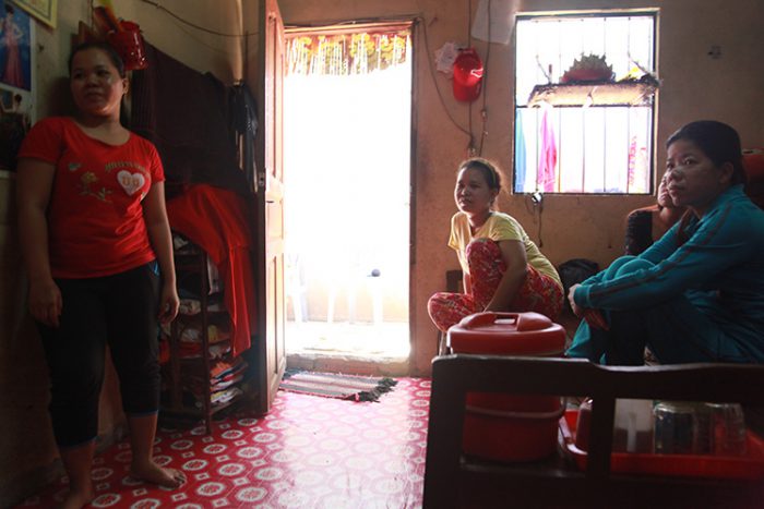 Matt (center) is the eldest of four siblings. She has been working in garment factories to support them for the past ten years. Photo by Sok Chanrado